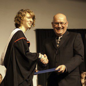 Bethany president Howie Wall congratulates Brittany Suderman, winner of the 4th-year academic award 